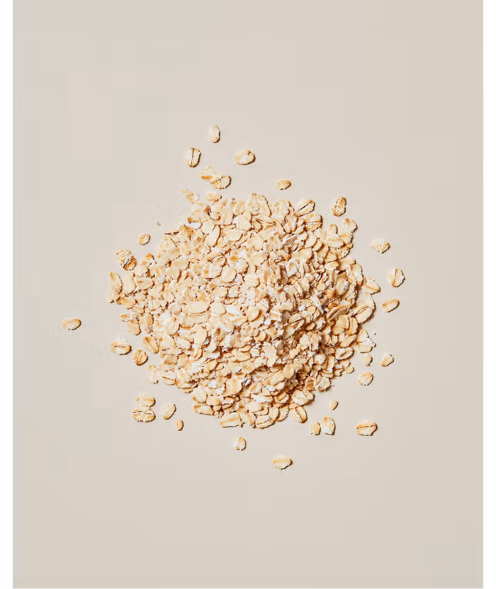 Wooden bowl filled with rolled oats